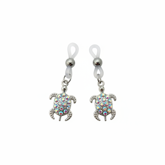 Schildpad tepelhangers met glinsterende steentjes op witte achtergrond