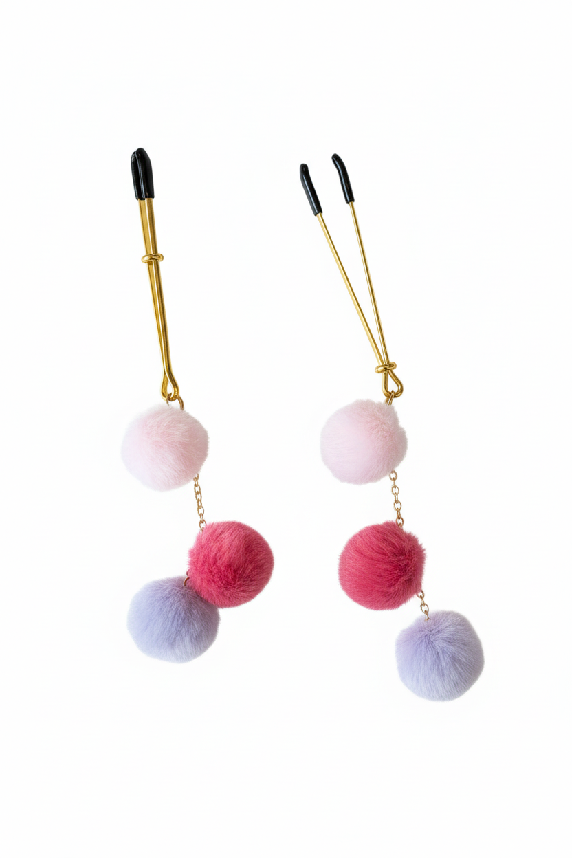 Goudkleurige pompom tepelklemmen met licht roze, roze en lila pompons