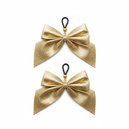 Gouden strik tepelhangers - elegant design met metallic afwerking