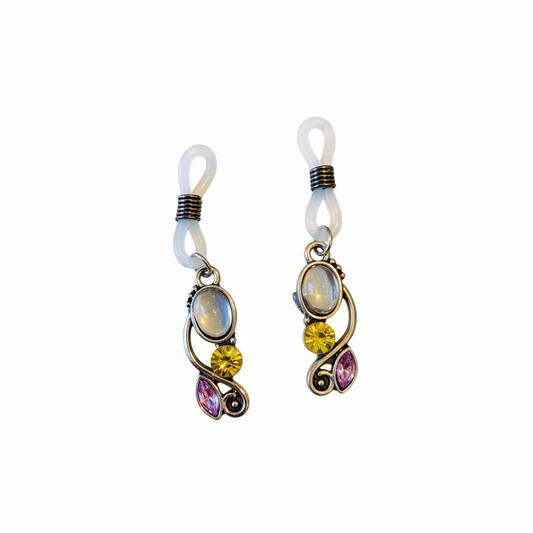 Tepelhangers met gekleurde kristallen in zilverkleurige swirl zetting