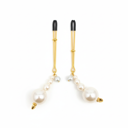 Parel tepelklemmen - elegant design met graduerende parels en gouden afwerking